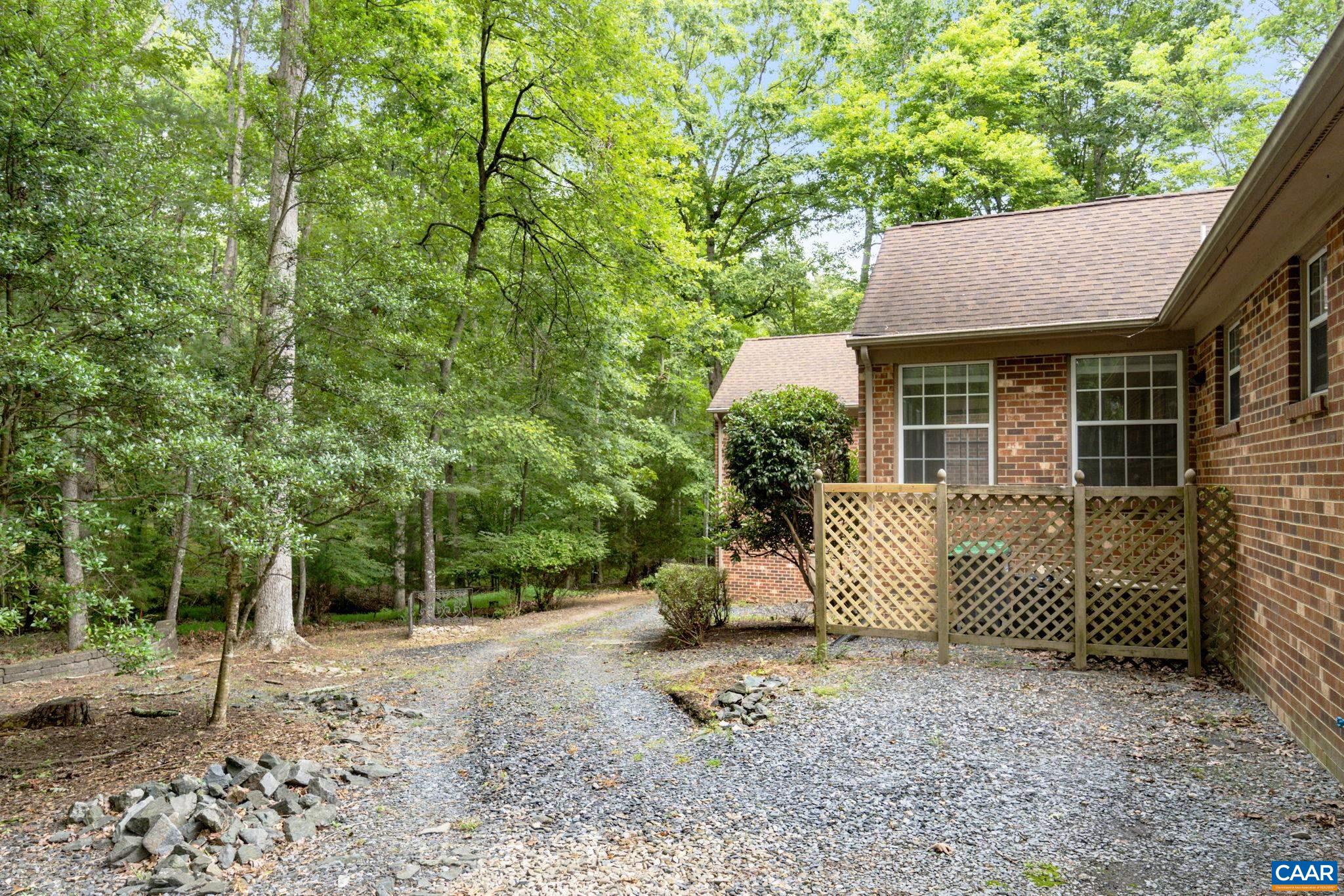 41 Colonial Road Palmyra, VA 22963 - Photo 9 of 53 a view of a white house with a large tree and a yard
