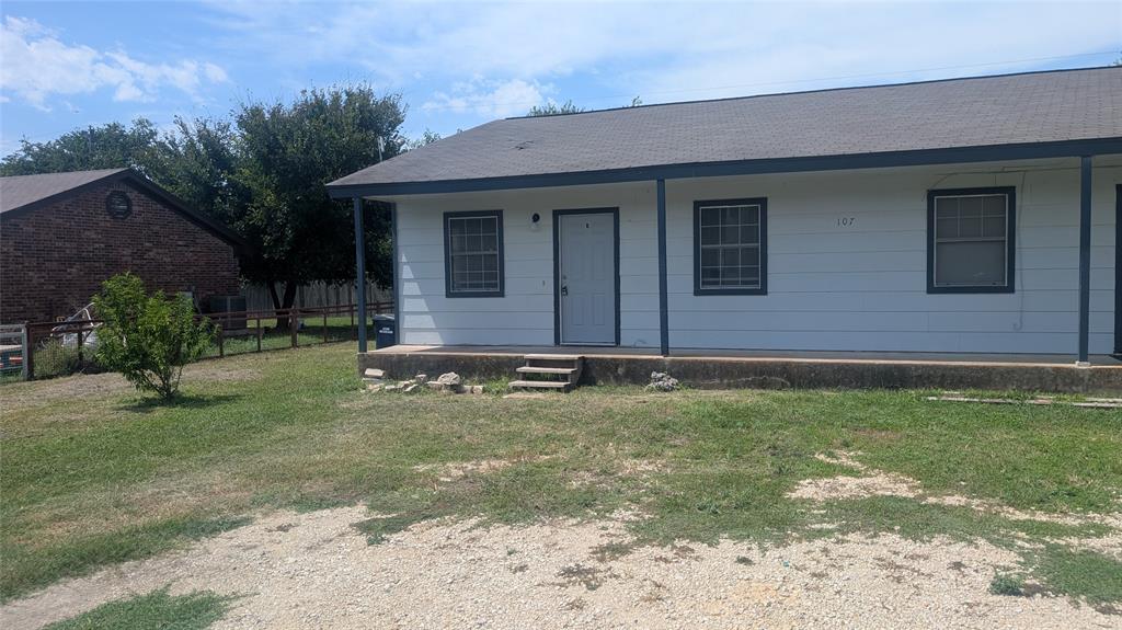 107 Beck Street, Unit B Florence, TX 76527 - Photo 1 of 8 A classic facade with a covered porch offers inviting curb appeal.
