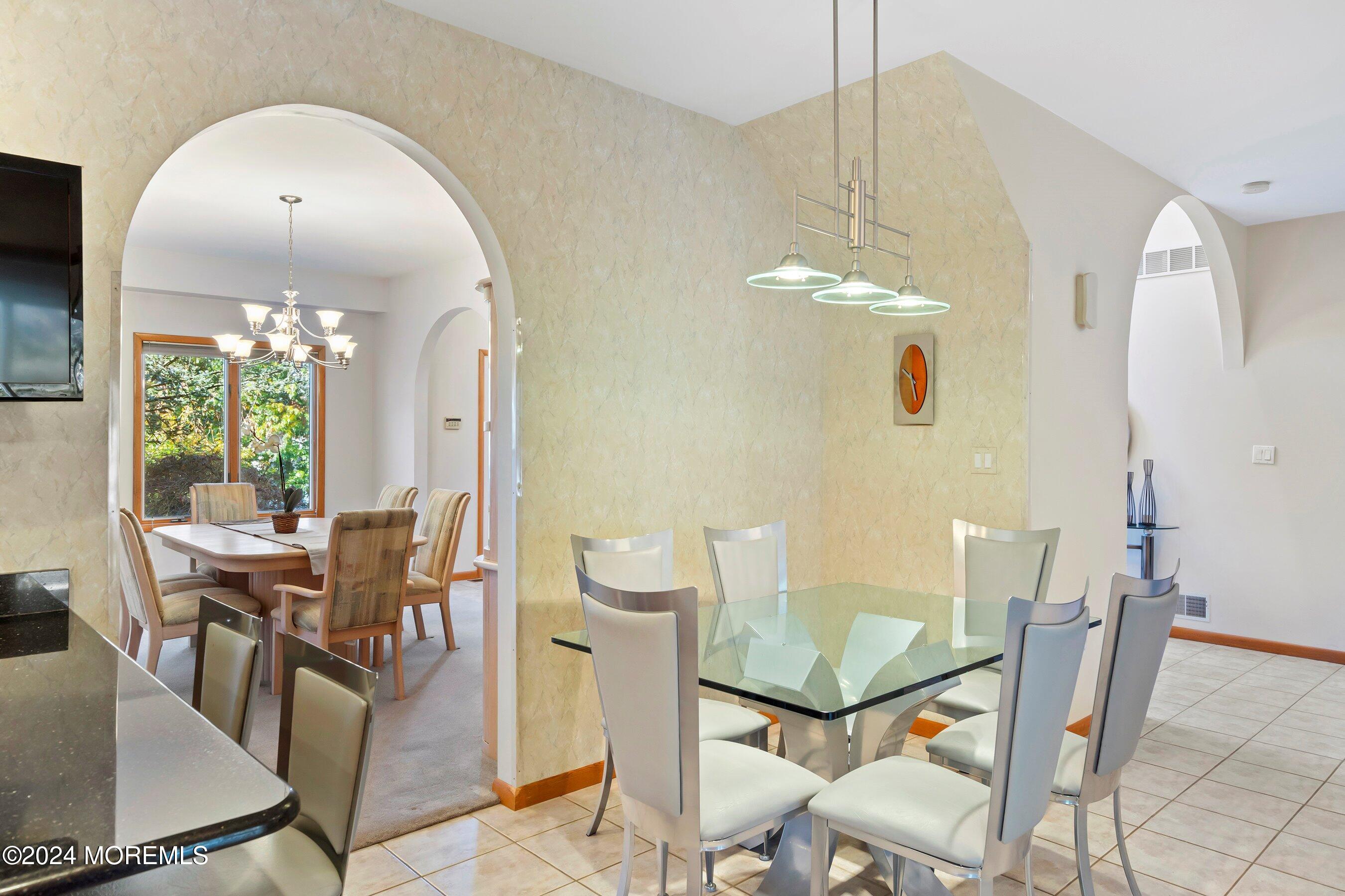 742 Rabbit Run Brick, NJ 08724 - Photo 15 of 51 a view of a dining room with furniture and chandelier