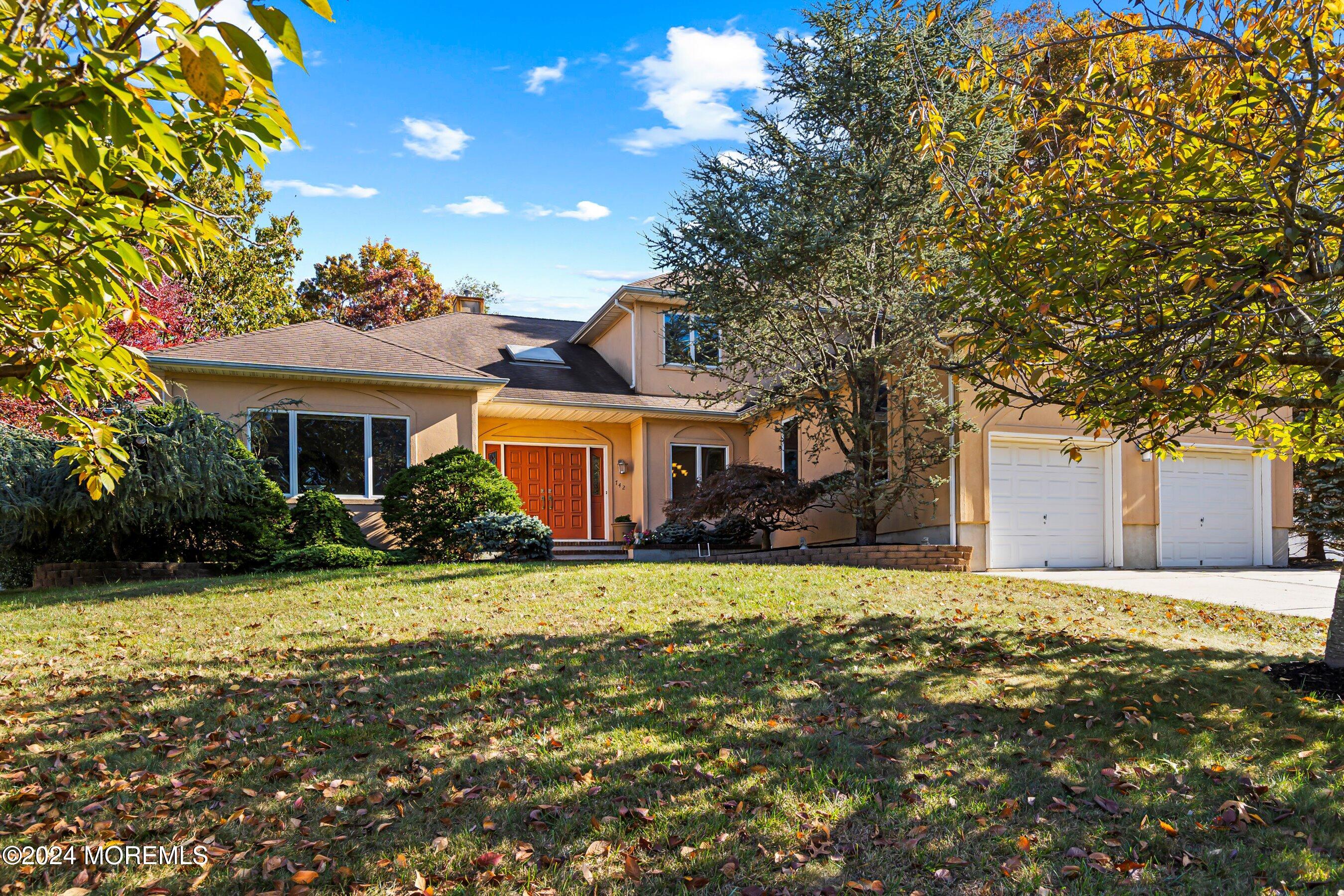 742 Rabbit Run Brick, NJ 08724 - Photo 2 of 51 a front view of a house with a yard and garage