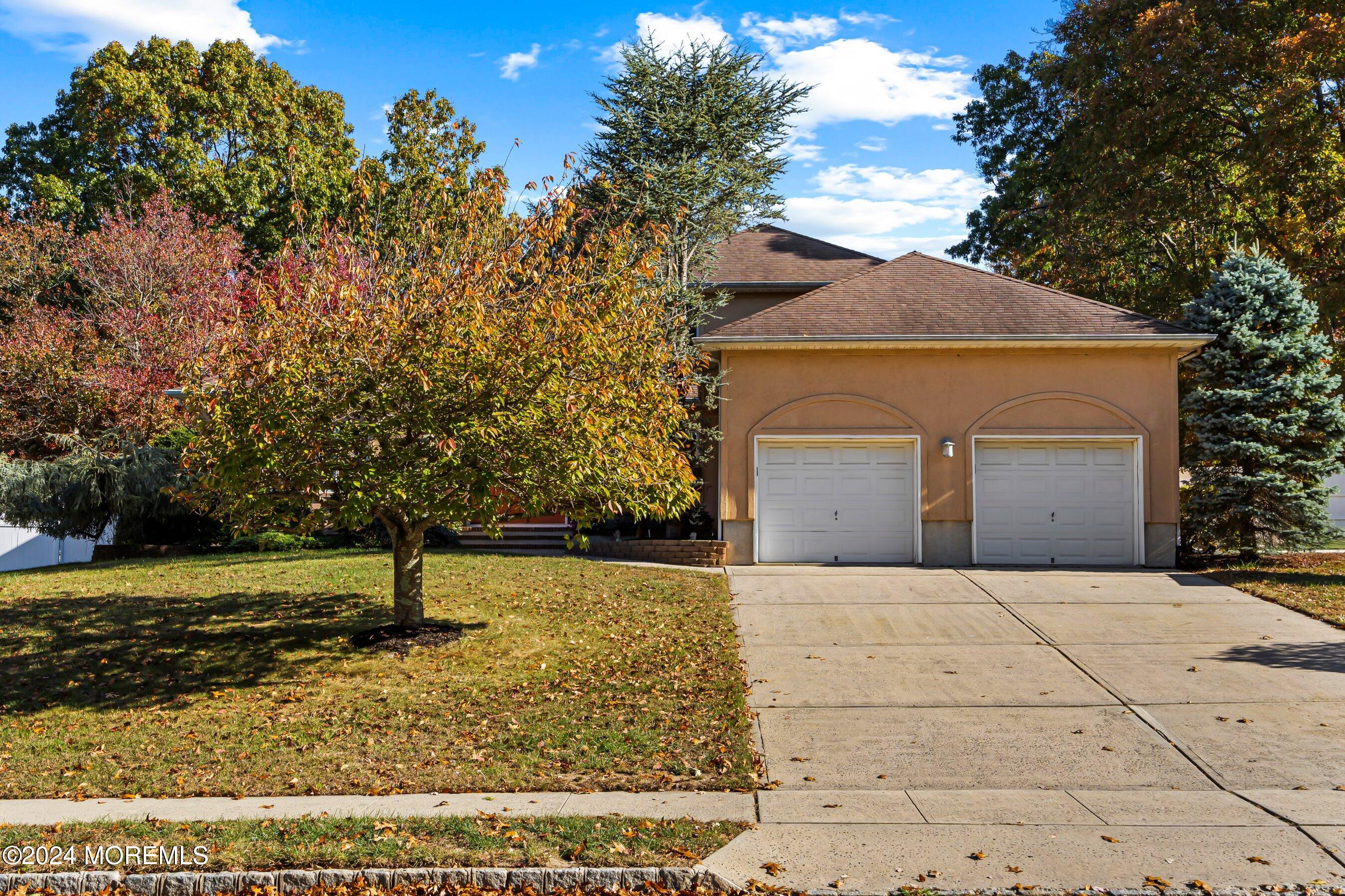 742 Rabbit Run Brick, NJ 08724 - Photo 3 of 51 a front view of a house with a yard