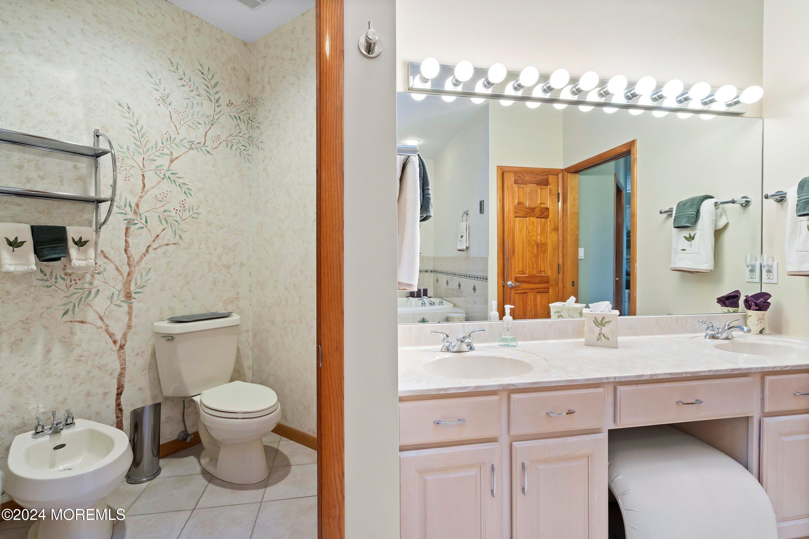 742 Rabbit Run Brick, NJ 08724 - Photo 31 of 51 a bathroom with a toilet sink and mirror