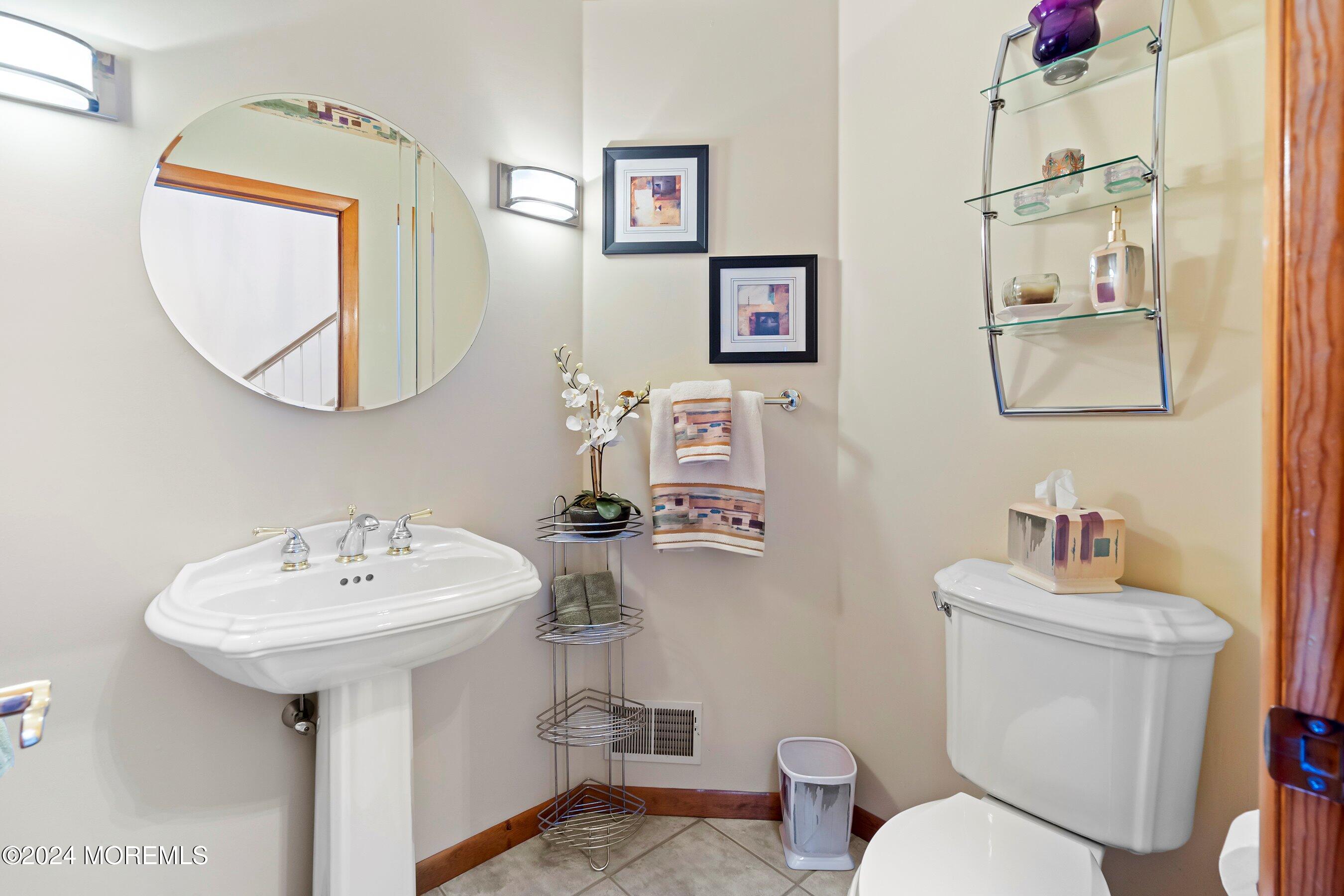 742 Rabbit Run Brick, NJ 08724 - Photo 32 of 51 a bathroom with a toilet sink and mirror