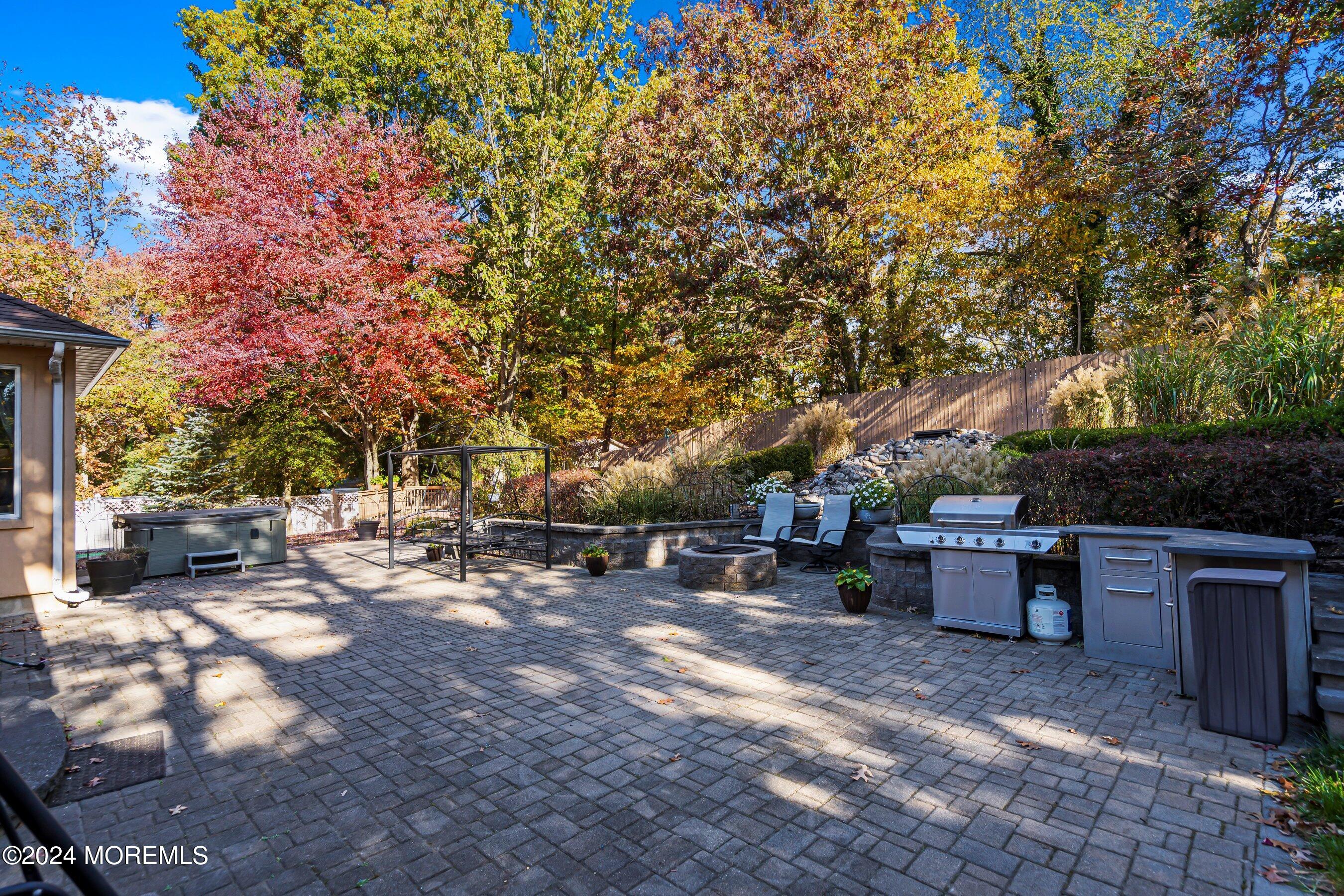 742 Rabbit Run Brick, NJ 08724 - Photo 47 of 51 a view of a backyard with table and chairs potted plants and tree