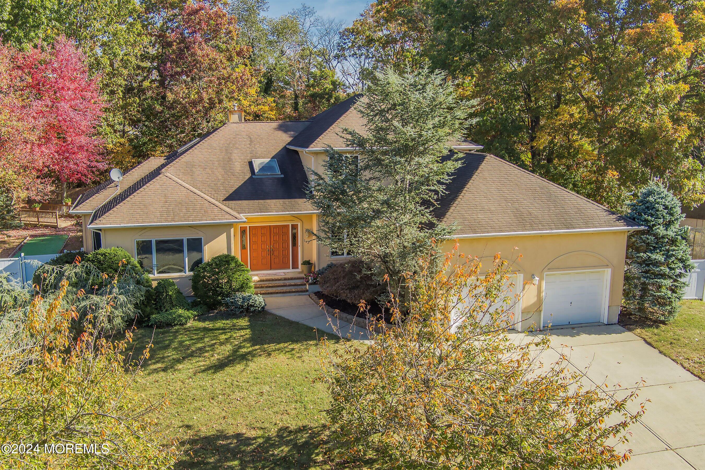 742 Rabbit Run Brick, NJ 08724 - Photo 5 of 51 a front view of a house with a yard and garage
