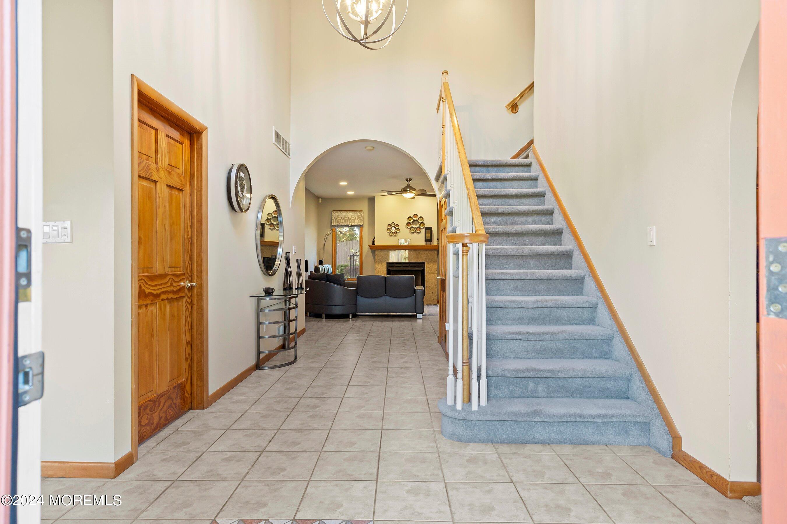 742 Rabbit Run Brick, NJ 08724 - Photo 8 of 51 a view of entryway and hall with wooden floor
