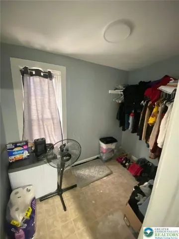 a room with gym equipment and a window