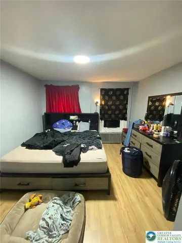 a kitchen with stainless steel appliances kitchen island granite countertop a stove a refrigerator and a sink