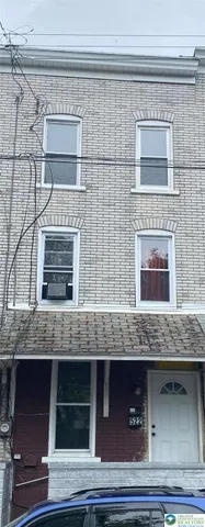 a view of fireplace and kitchen
