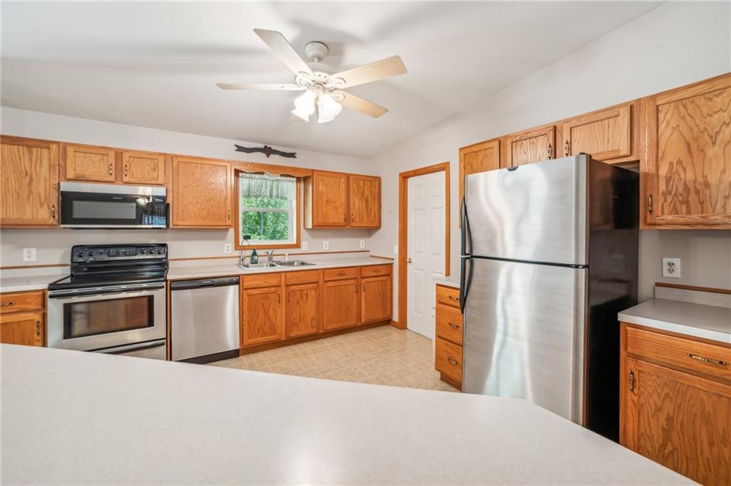 452 Upper Service Road Hookstown, PA 15050 - Photo 24 of 41 a kitchen with stainless steel appliances a refrigerator sink and cabinets