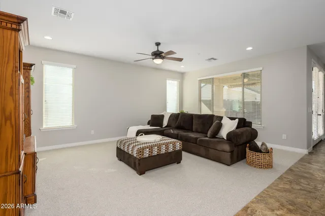 a kitchen with kitchen island granite countertop wooden cabinets a dining table and chairs