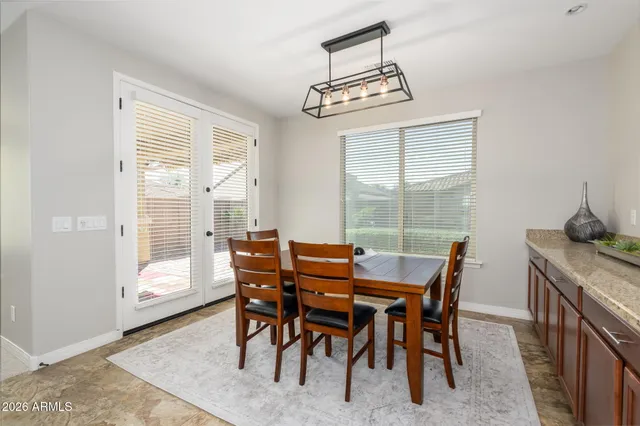 a kitchen with cabinets and window