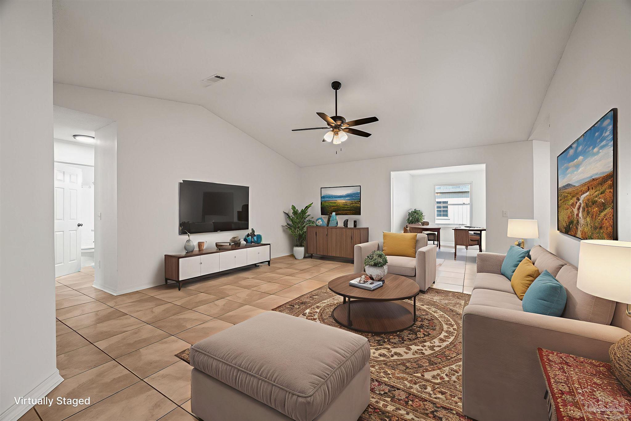 4263 Crosswind Drive Milton, FL 32583 - Photo 12 of 43 a living room with furniture and a flat screen tv