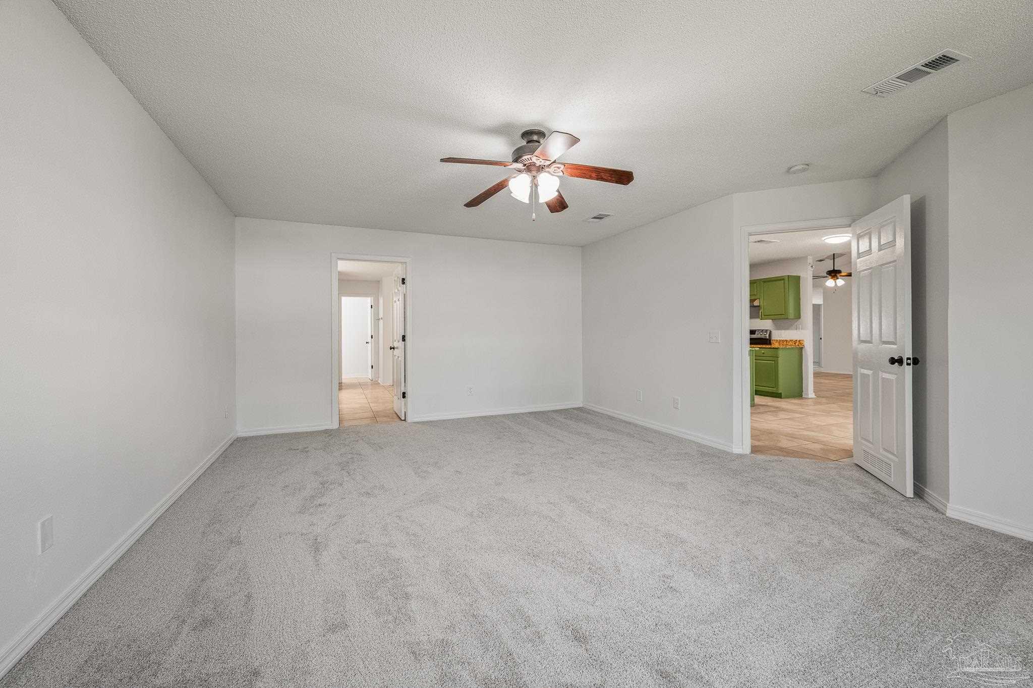 4263 Crosswind Drive Milton, FL 32583 - Photo 25 of 43 a view of empty room with ceiling fan