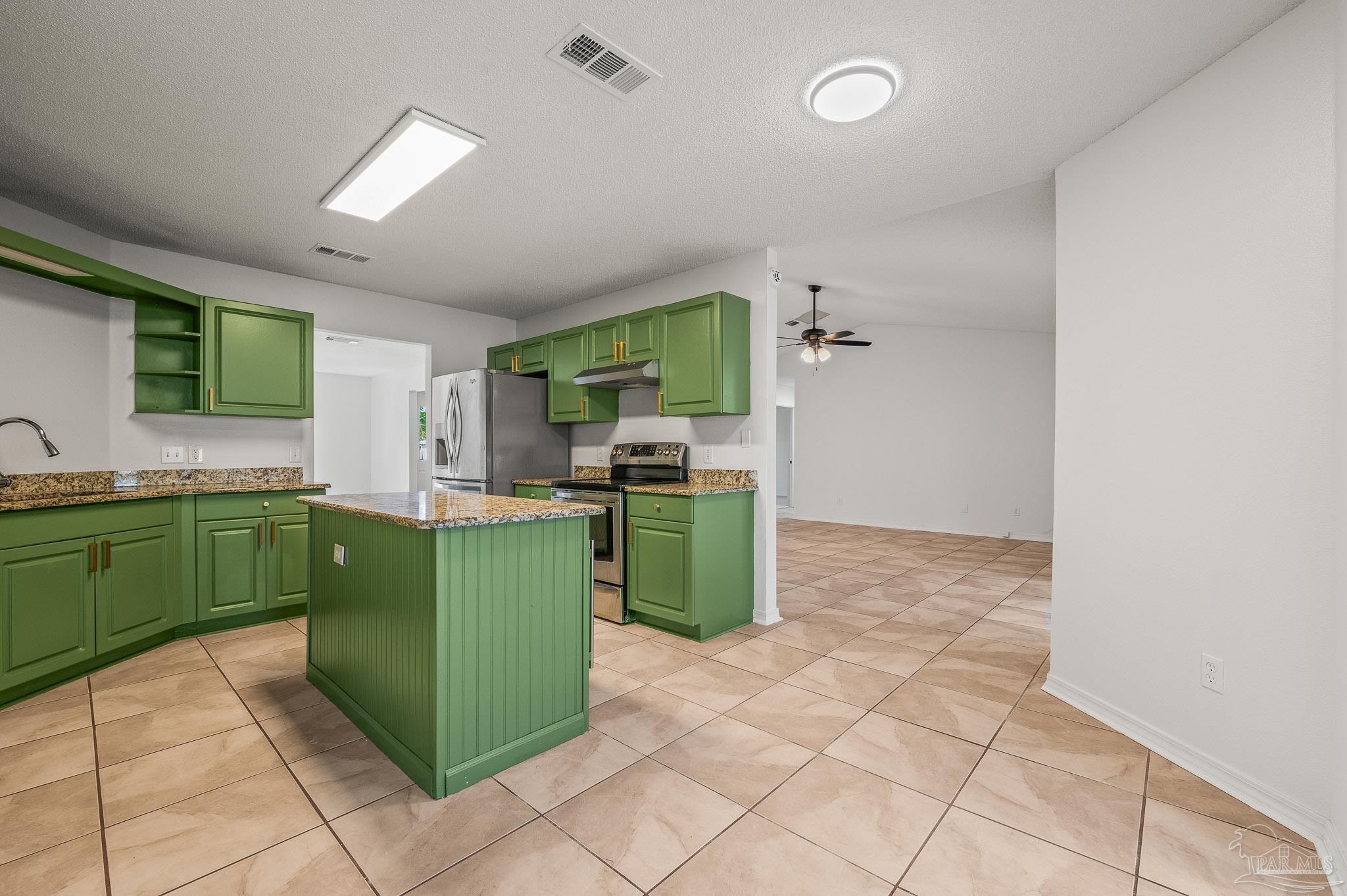 4263 Crosswind Drive Milton, FL 32583 - Photo 34 of 43 a kitchen with green cabinets and a sink