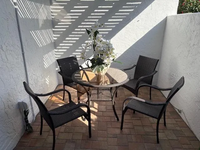 a dining room with furniture and a chandelier