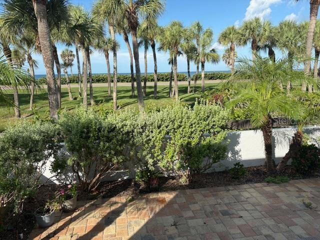 737 Bayport Way, Unit D Longboat Key, FL 34228 - Photo 15 of 31 a view of a yard with a tree