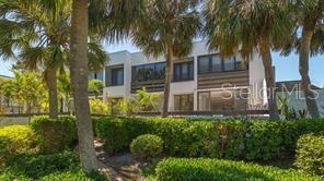 737 Bayport Way, Unit D Longboat Key, FL 34228 - Photo 22 of 31 a view of a garden with palm trees