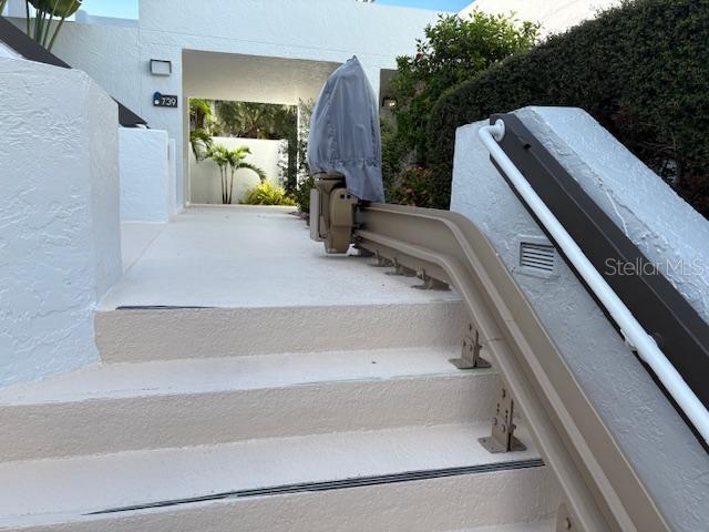 737 Bayport Way, Unit D Longboat Key, FL 34228 - Photo 24 of 31 a view of staircase with a rug