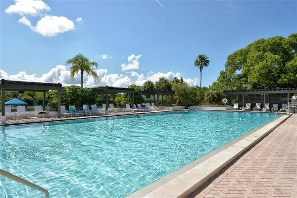 a view of a swimming pool with a patio