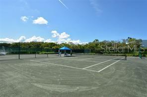 737 Bayport Way, Unit D Longboat Key, FL 34228 - Photo 26 of 31 a view of a tennis court