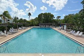 737 Bayport Way, Unit D Longboat Key, FL 34228 - Photo 27 of 31 a view of a swimming pool with a patio