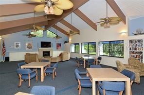 737 Bayport Way, Unit D Longboat Key, FL 34228 - Photo 28 of 31 a view of a dining room with furniture window and outside view