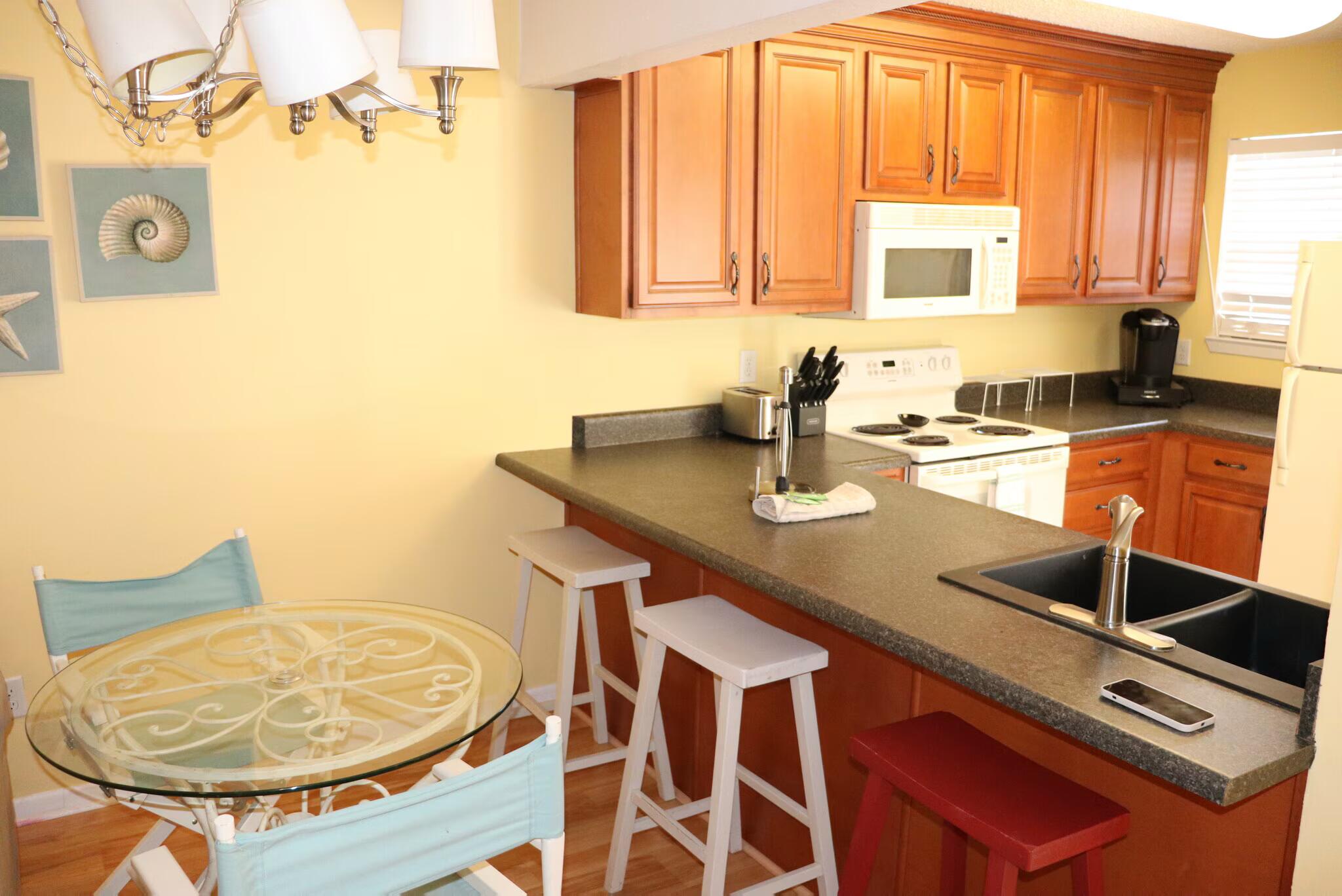 a kitchen with a sink cabinets and window