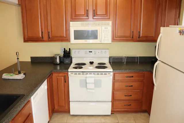a kitchen with appliances and cabinets