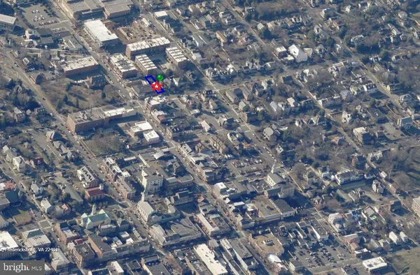 an aerial view of a building with parking space