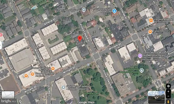 a car parked in front of a brick house