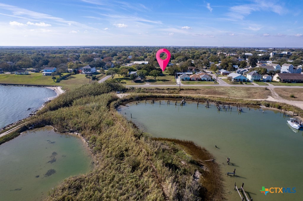 Tbd Commerce Street Port Lavaca, TX 77979 - Photo 4 of 12 a view of a lake with a mountain