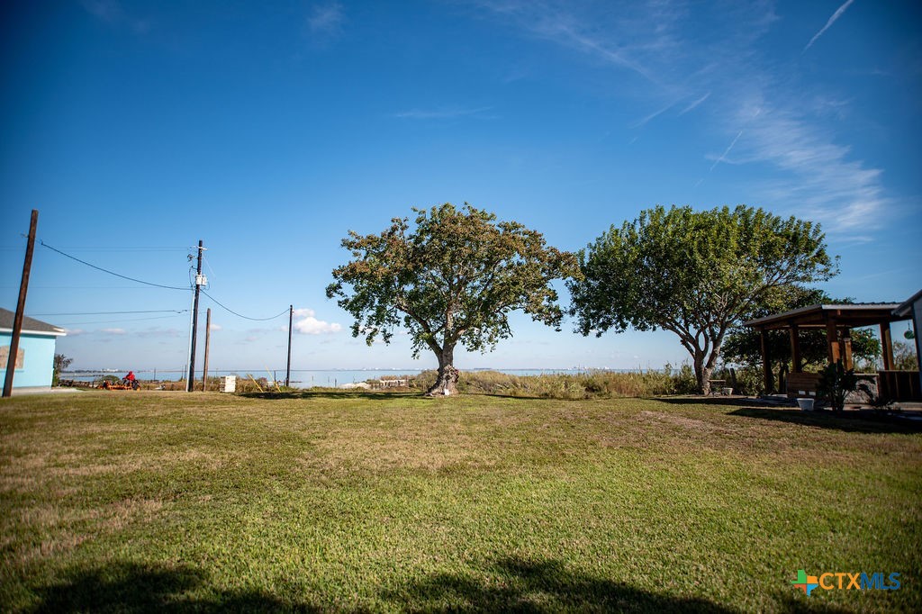 Tbd Commerce Street Port Lavaca, TX 77979 - Photo 10 of 12 a front view of a house with a yard