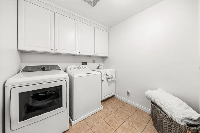 a bathroom with a sink double vanity and a mirror