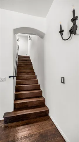 a bathroom with a granite countertop sink a large mirror and a bathtub with shower