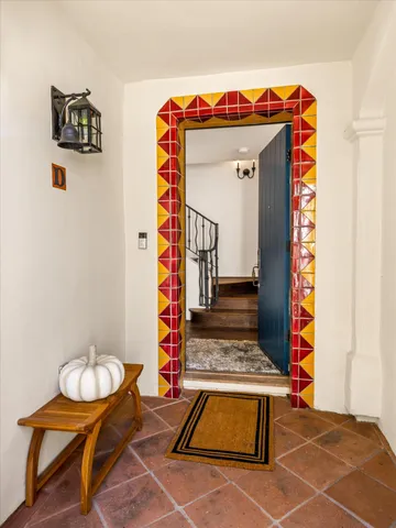 a view of entryway with wooden floor and stairs