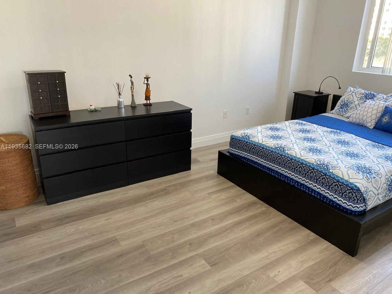 601 Northeast 23rd Street, Unit 706 Miami, FL 33137 - Photo 19 of 25 a bedroom with a bed and window