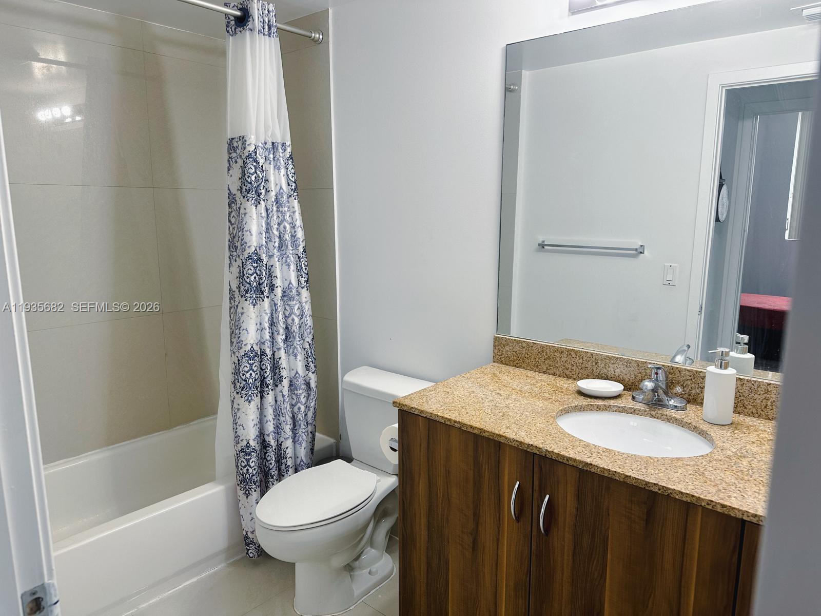 601 Northeast 23rd Street, Unit 706 Miami, FL 33137 - Photo 23 of 25 a bathroom with a sink toilet and shower
