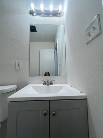 a bathroom with a sink and a toilet