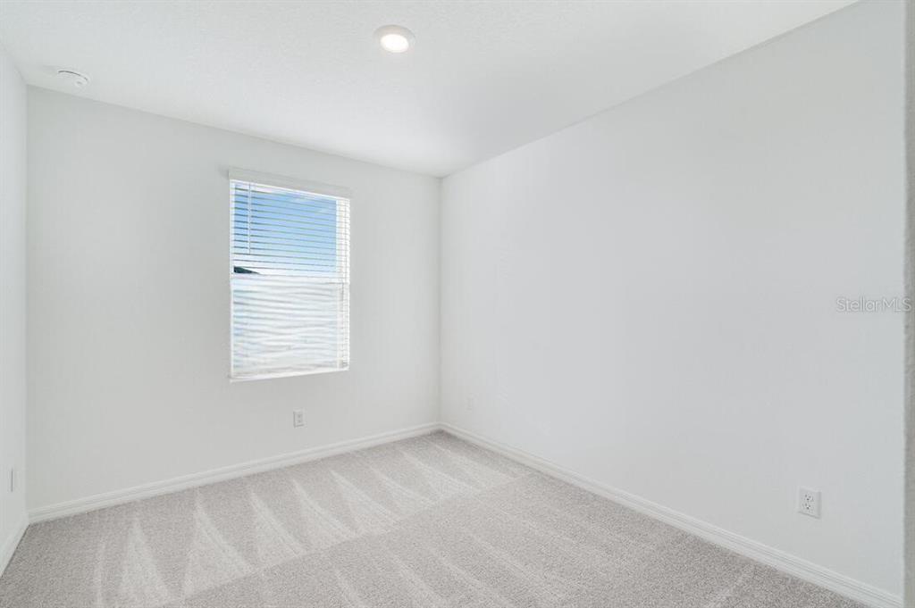 3035 Novara Lane Lakewood Ranch, FL 34211 - Photo 15 of 18 a view of an empty room with a window