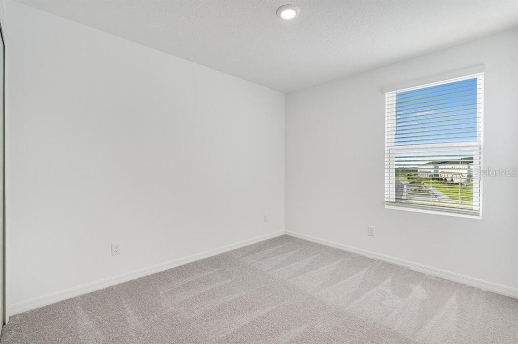 3035 Novara Lane Lakewood Ranch, FL 34211 - Photo 17 of 18 an empty room with a window