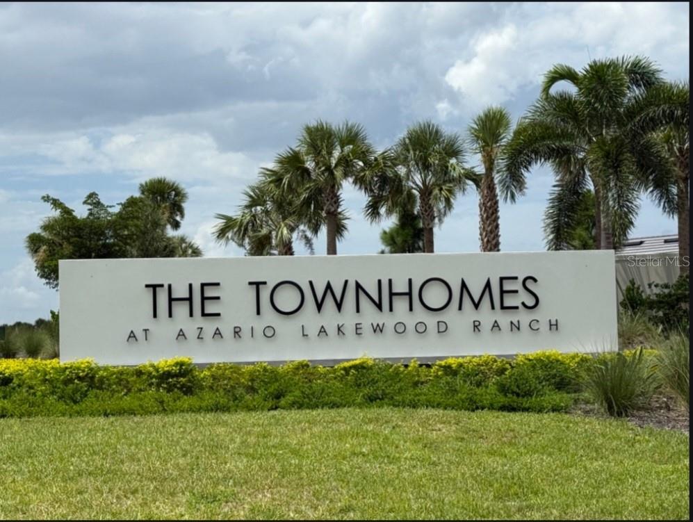 3035 Novara Lane Lakewood Ranch, FL 34211 - Photo 2 of 18 a sign that is on the side of a field