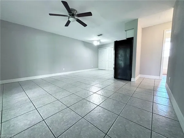 a view of an empty room and a window