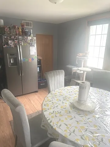 a bedroom with a bed and chandelier