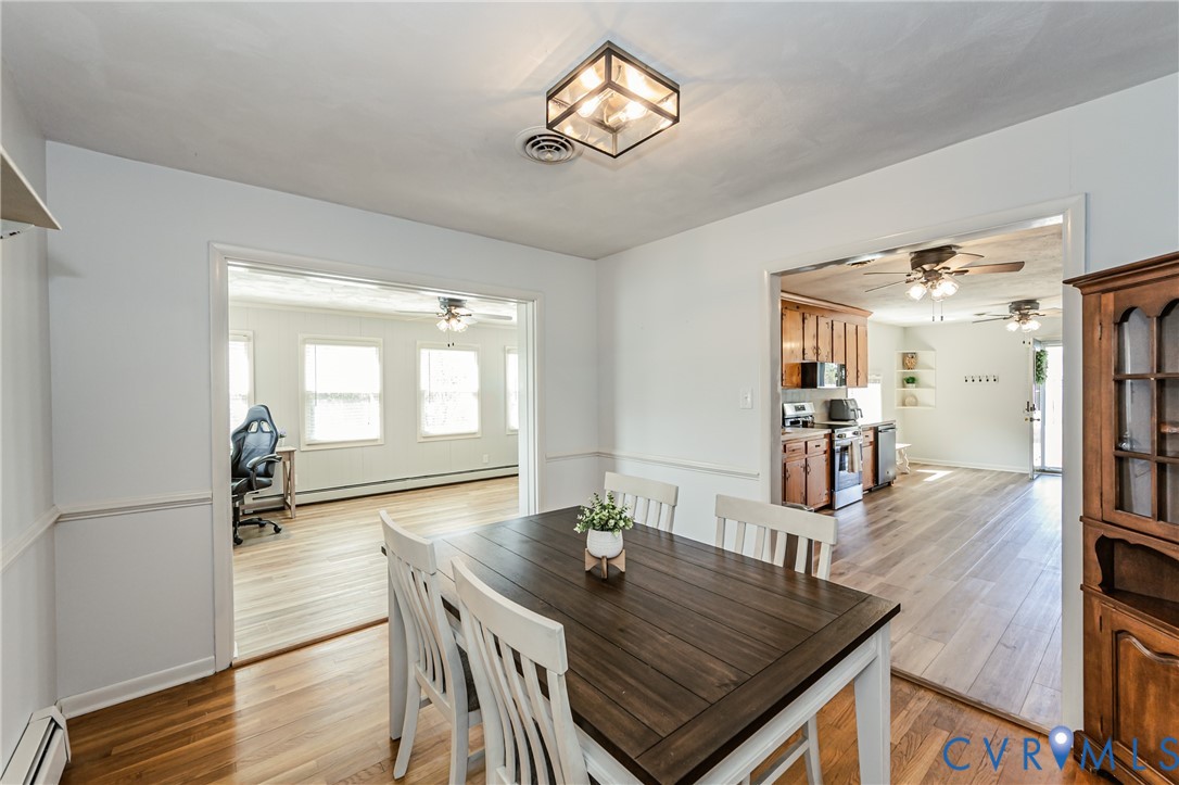 1927 F Street West Point, VA 23181 - Photo 11 of 59 a view of a dining room with furniture and wooden floor