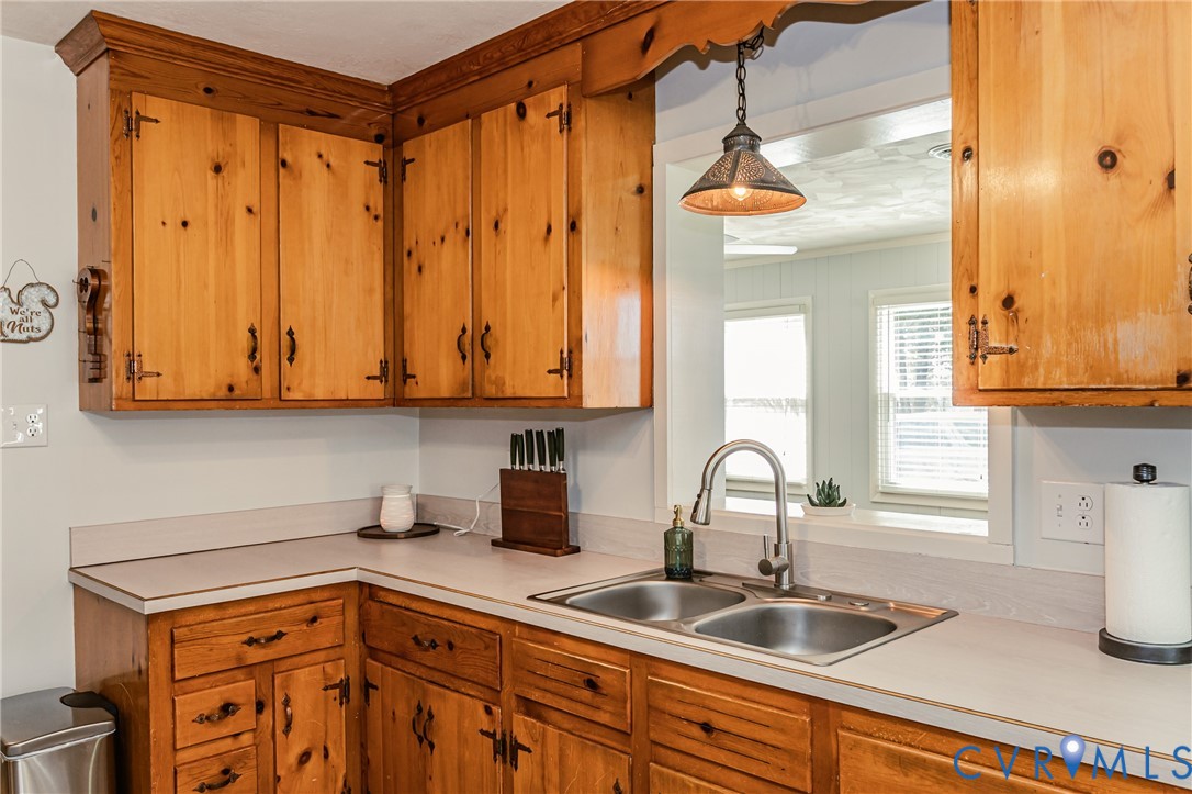 1927 F Street West Point, VA 23181 - Photo 14 of 59 a kitchen with stainless steel appliances granite countertop a sink and a window