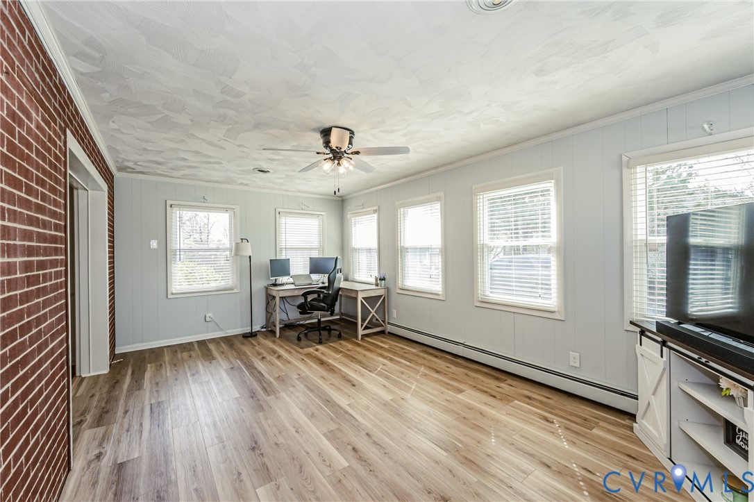 1927 F Street West Point, VA 23181 - Photo 23 of 59 a view of an empty room with a window and wooden floor
