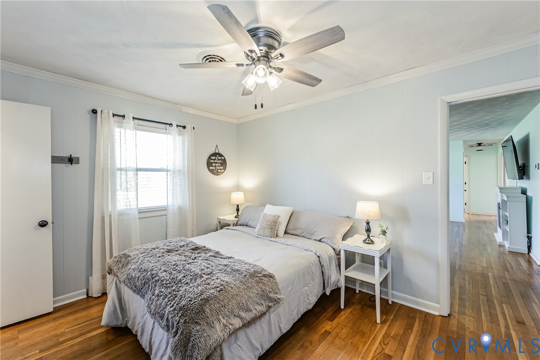 1927 F Street West Point, VA 23181 - Photo 25 of 59 a bedroom with a bed and wooden floor