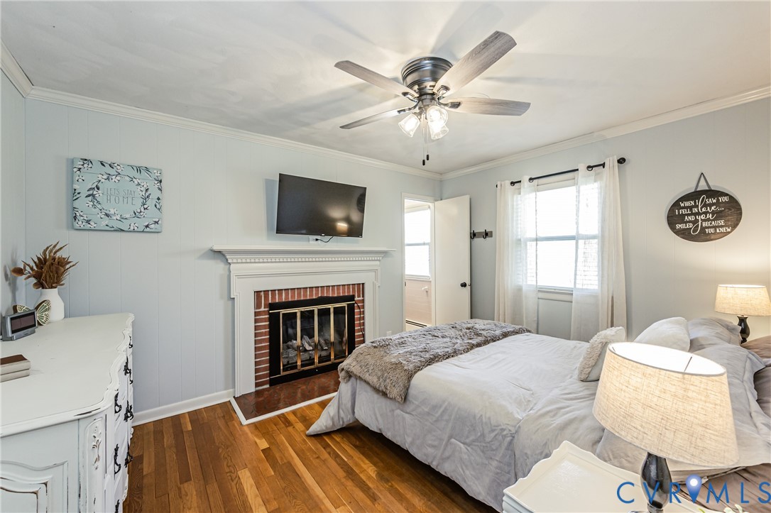 1927 F Street West Point, VA 23181 - Photo 27 of 59 a spacious bedroom with a bed and a fireplace