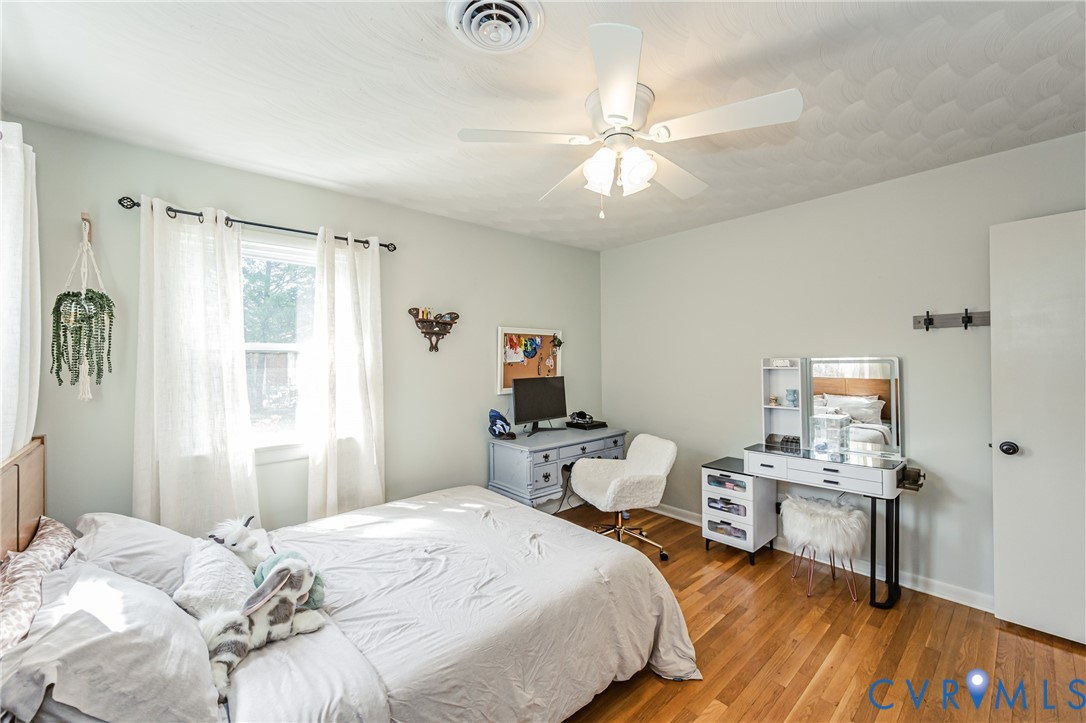 1927 F Street West Point, VA 23181 - Photo 36 of 59 a bedroom with a bed and wooden floor